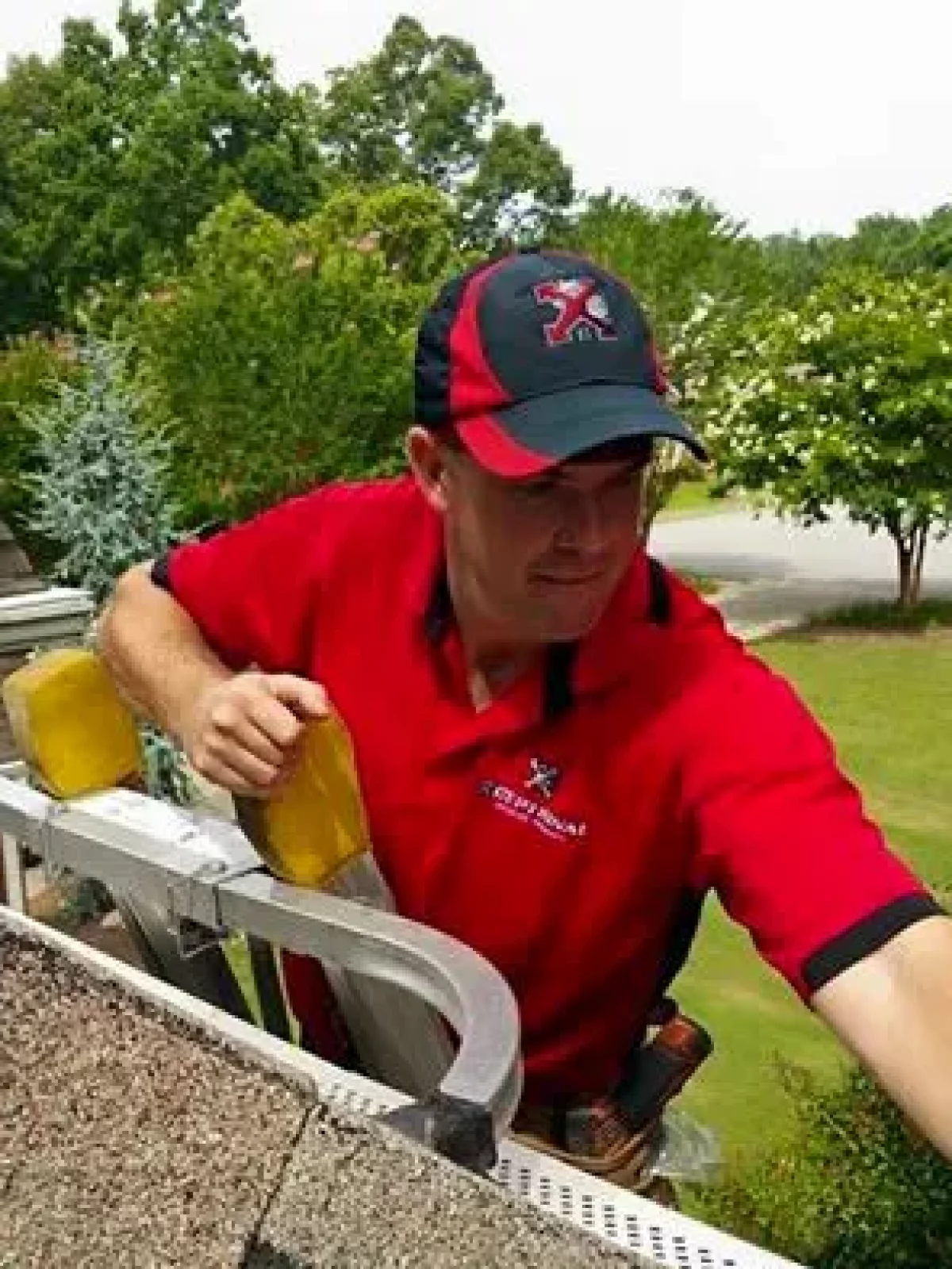 Technician inspecting the gutters